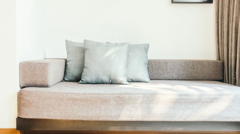 Use Single-Colored Cushions, Rugs, and Picture Frames